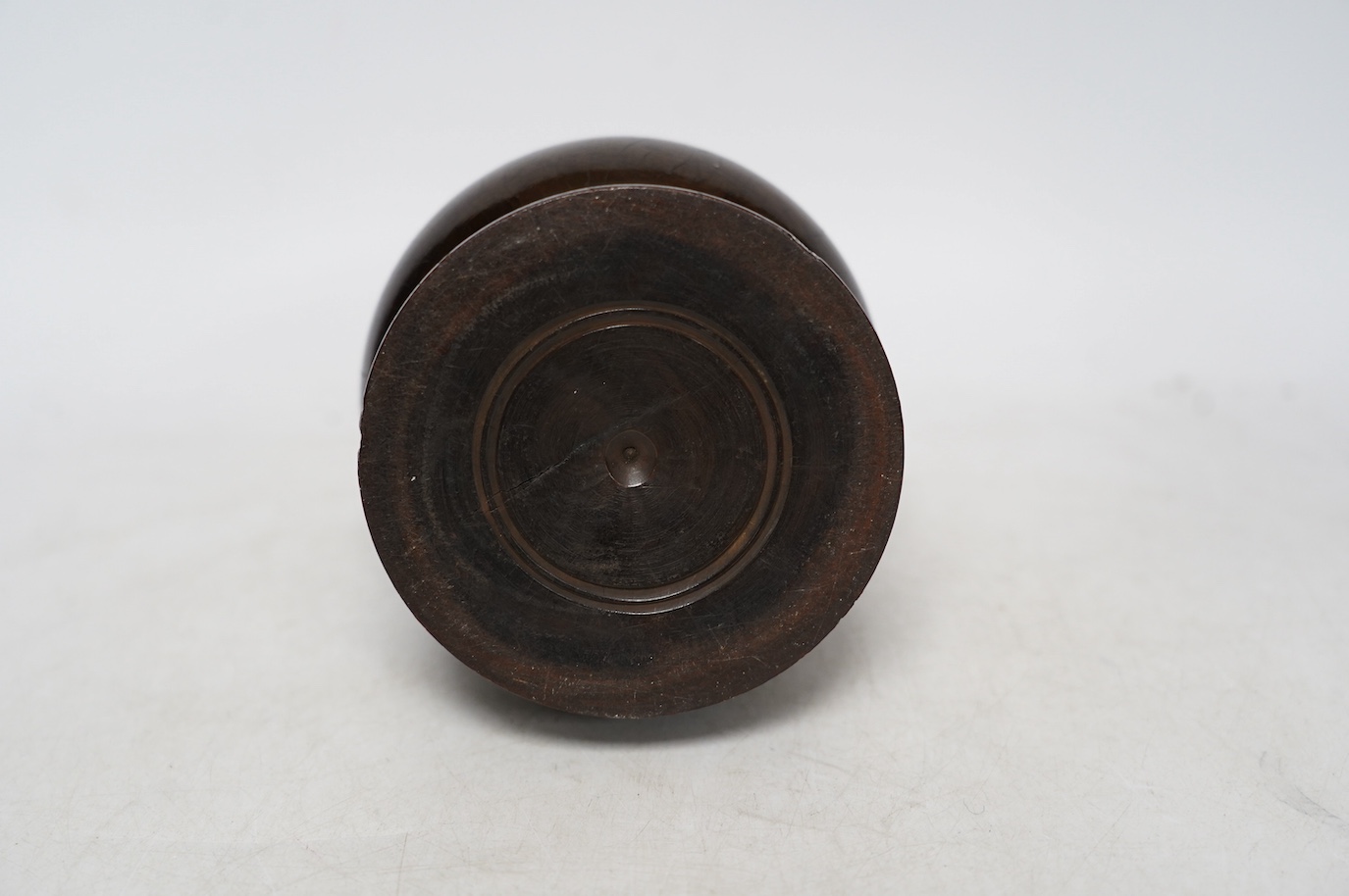 A Lignum Vitae storage vessel with a cutter / blade surmounted on the cover, possibly for cutting and storing spices, 18cm high. Condition - fair to good